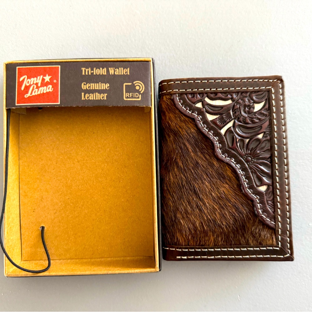 Tony Lama Genuine Leather RIFD brown, tooled, and animal hide tri-fold wallet.